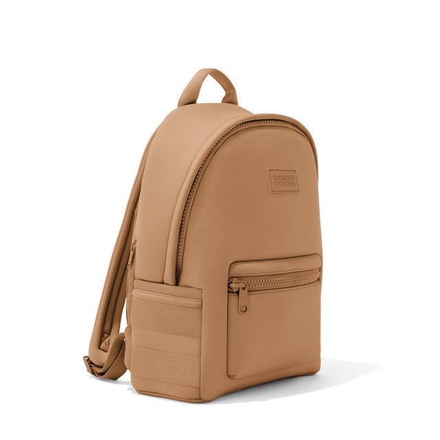 Dagne Dover medium Dakota Neoprene Backpack in camel brown seen from an angle.